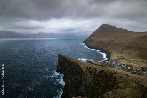 Scenic Village of Gjógv in the Faroe Islands, Nestled Between Cliffs and Ocean