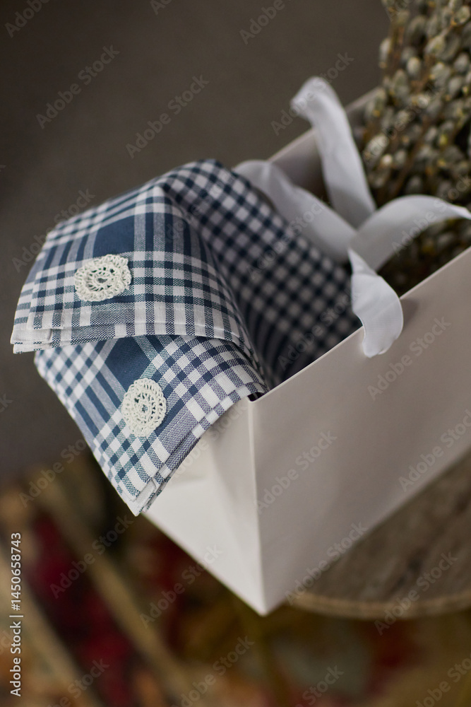 An Elegant Gift Box beautifully adorned with a Green Design and complemented by White Handles