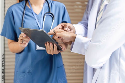 Doctor and nurse reviewing medical data in a collaborative environment