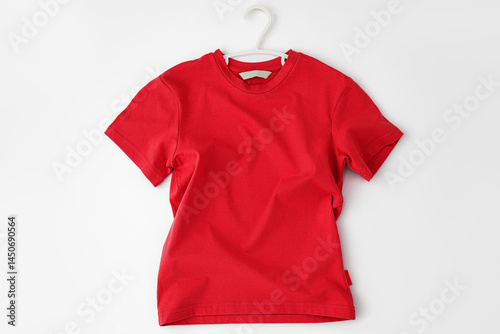 Mockup T-shirt hanging on Hanger crumpled and waves, front view lies isolated on white studio background with shadow. Blank red T Shirt with Wrinkled on background. Top view template clothes for
