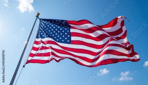 A large American flag is flying in the sky
