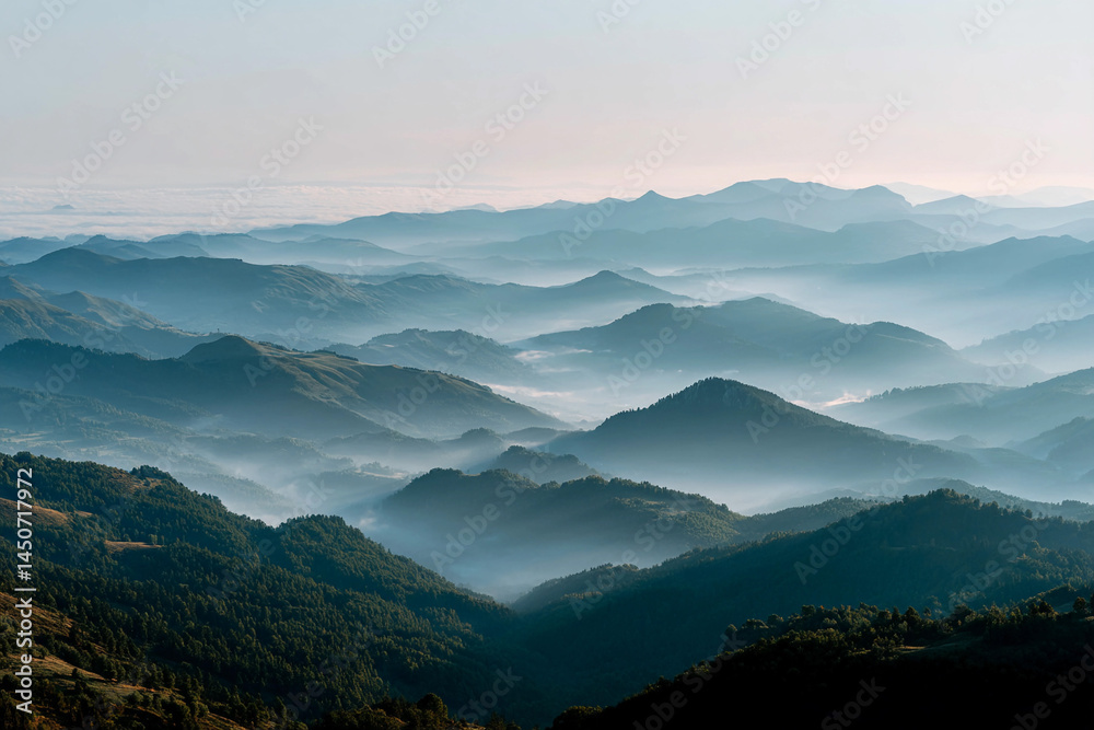 Fototapeta premium Stunning panoramic view of misty mountains at dawn captures nature's tranquility in vibrant colors