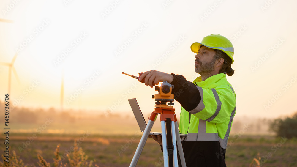 custom made wallpaper toronto digitalA field engineer surveys the land at sunset, with wind turbines behind as technology meets clean energy.