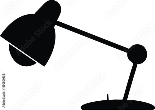 A black desk lamp in simple silhouette casts a shadow, isolated on white