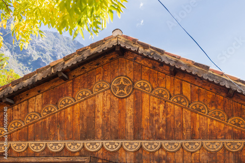 Obraz na płótnie Decorations under the eaves of a traditional wooden building in Albania. w salonie