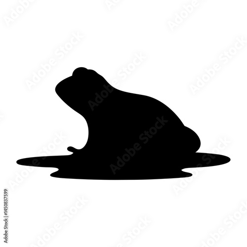 Silhouette of a frog sitting in a pool of water or swamp