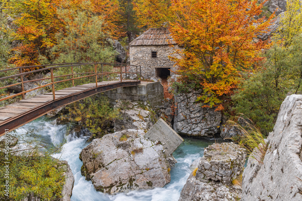 An old stone grist mill and footbridge on the Valbonas River in Valbona Valley National Park.