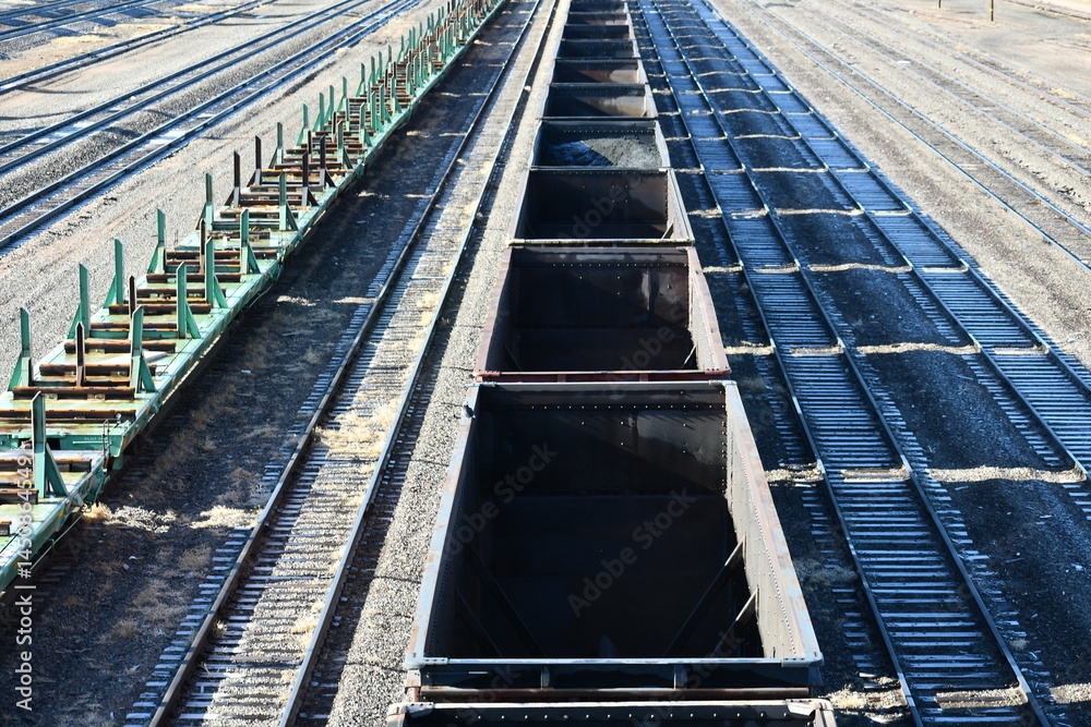 Railyard full of empty cars. Railyard full of empty cars.