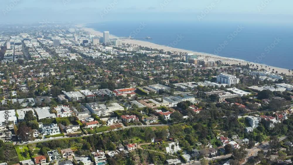 Aerial pullback shot of Santa Monica Los Angeles homes beach coast ocean trees Aerial pullback shot of Santa Monica Los Angeles homes beach coast ocean trees