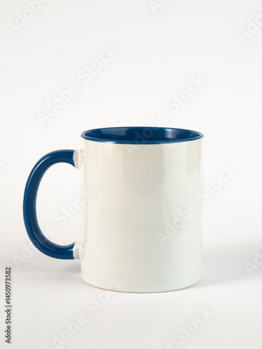 Two-tone 11oz mug on isolated background. Mug with blue handle and inner part.