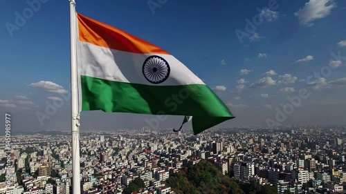 Large Indian Flag Waving in Front of City Skyline for Republic and Independence Day.