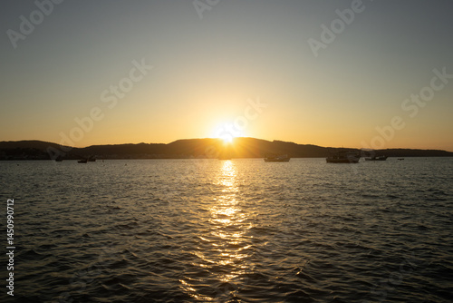 Golden Coastline Sunset – Boats, Nature and Ocean Calm