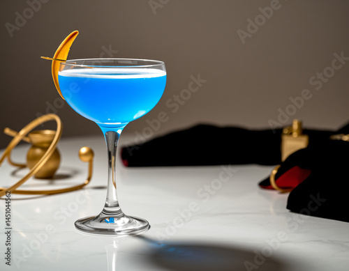 Blue Curacao cocktail with an electric blue glow in a designer glass, perfect for luxury drink presentations and branding