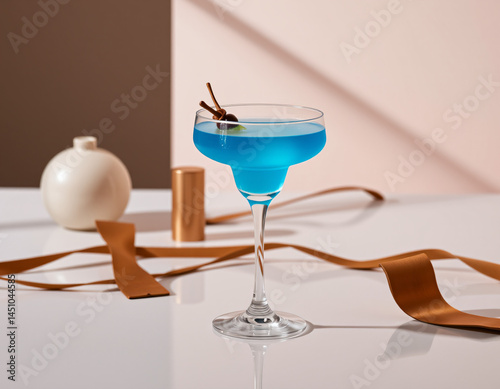 Blue Curacao cocktail with an electric blue glow in a designer glass, perfect for luxury drink presentations and branding