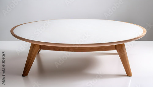 minimalist coffee table with white lacquered top and natural oak legs on white background for modern decor