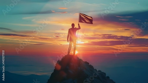 Silhouette of a businessman planting a flag on a mountain peak at sunset, symbolizing success and achievement