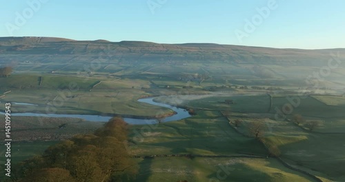 Sunny morning over curvy river in Yorkshire