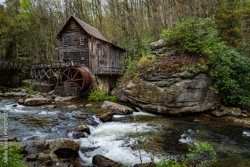 Serene quite waterfall in the woods of Appalachia Mountains, West Virginia State Park with Old Mill in background