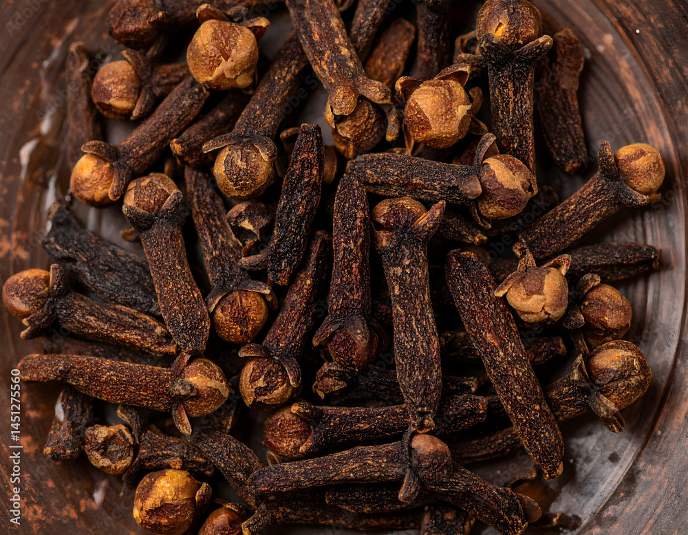 Closeup Of Dried Cloves On Brown Plate Closeup Of Dried Cloves On Brown Plate