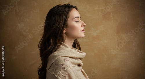 Young woman wearing linen clothes enjoying peace and serenity with closed eyes