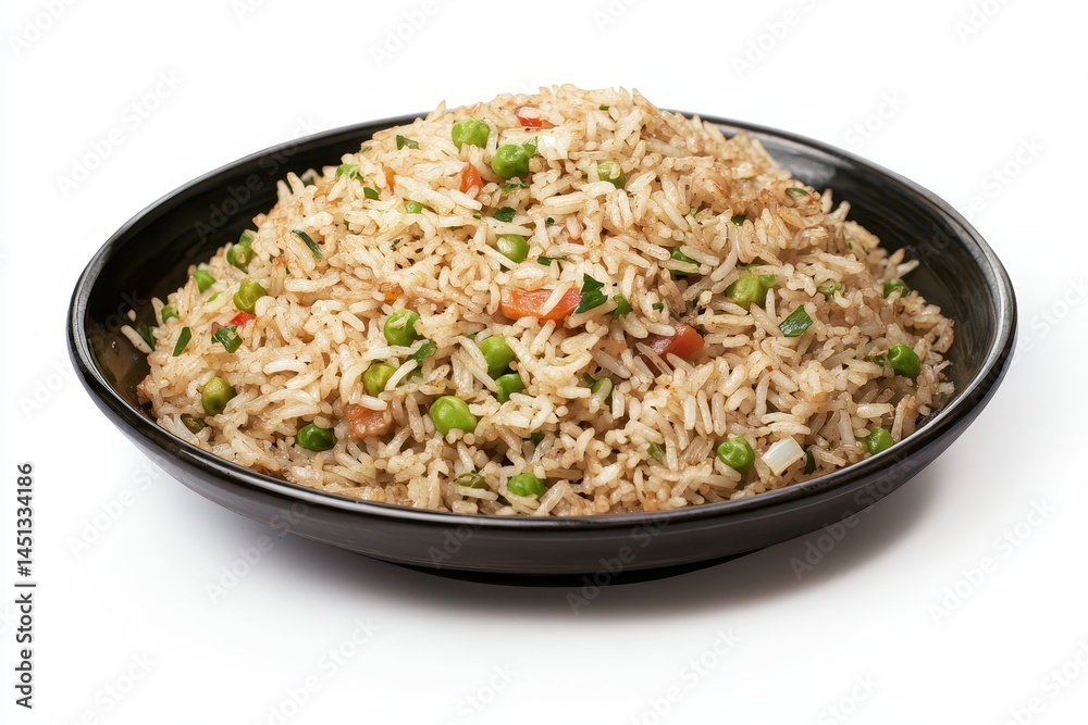 Savory fried rice with vegetables served in a black bowl on a white background Savory fried rice with vegetables served in a black bowl on a white background