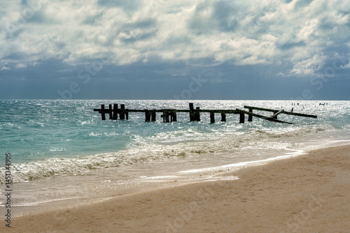 Broken pier piling on the beach at Punta Allen, Mexico