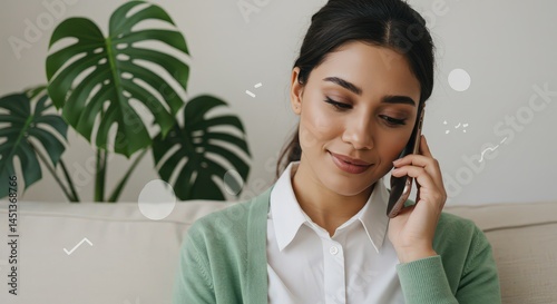 Woman Talking on Phone Sitting Indoors with Plant