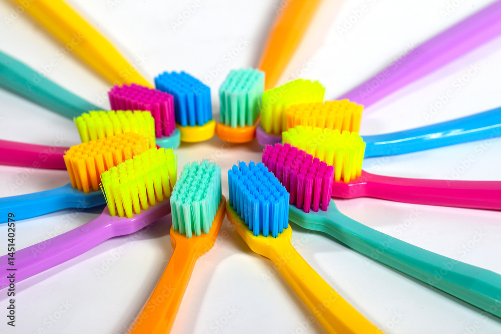A set of multicolored toothbrushes isolated on white background. Design concept for dental and oral health theme.