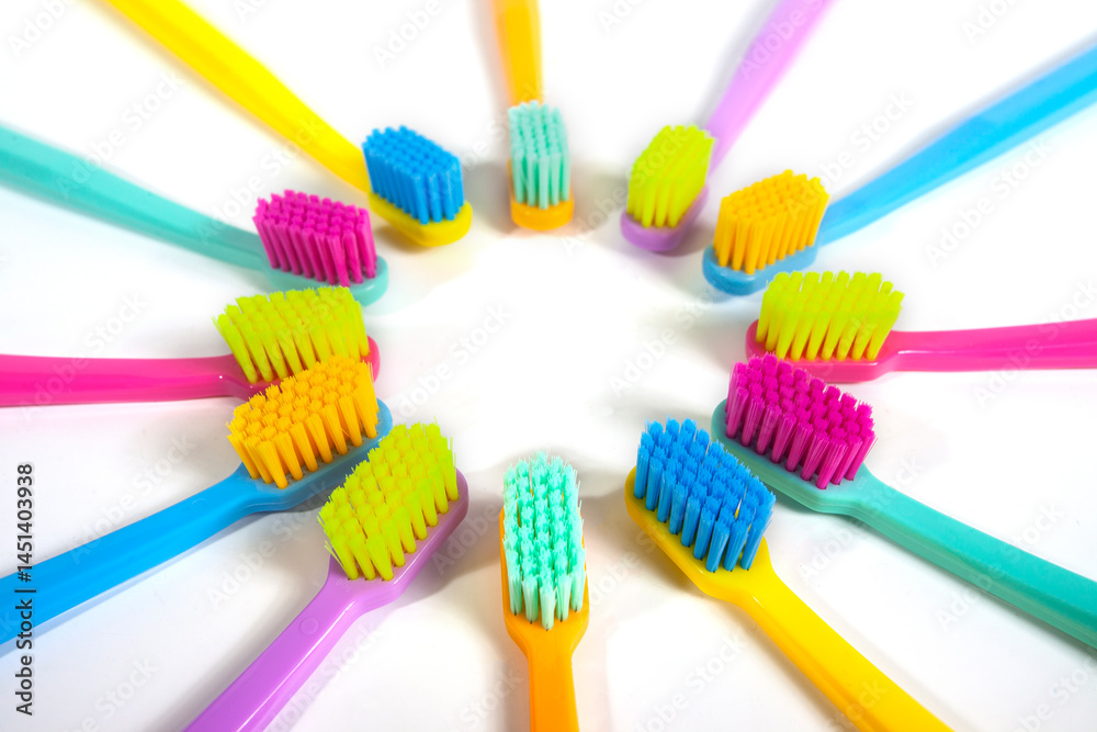 A set of multicolored toothbrushes isolated on white background. Design concept for dental and oral health theme.