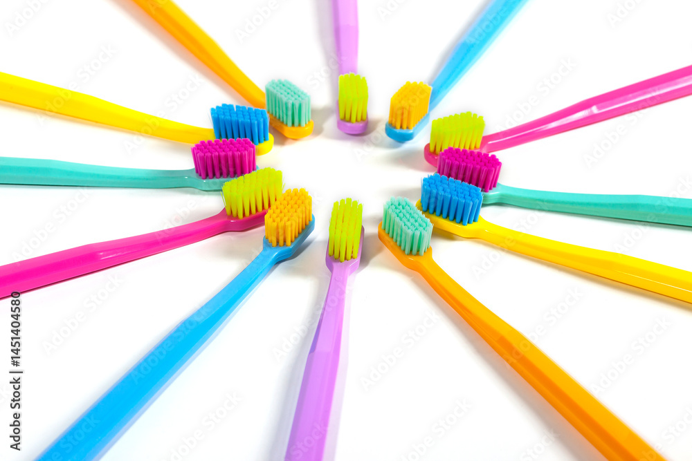 A set of multicolored toothbrushes isolated on white background. Design concept for dental and oral health theme.