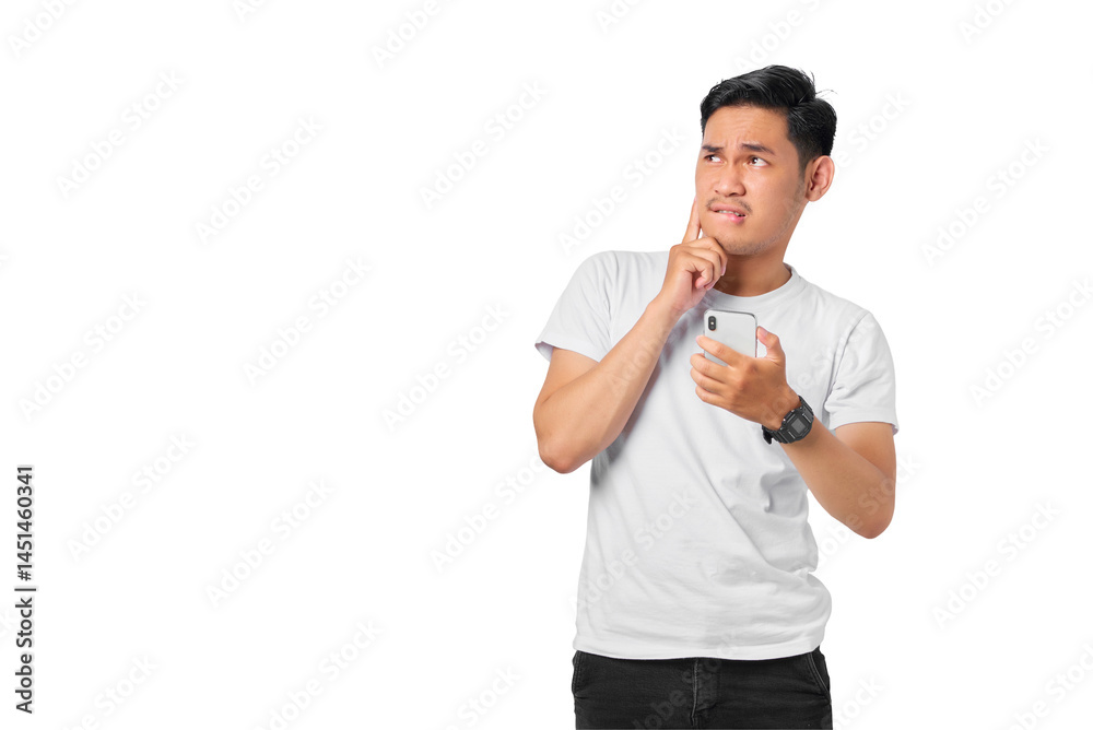 Pensive young Asian man with a serious face thinking about a question, using a mobile phone isolated on transparent background Pensive young Asian man with a serious face thinking about a question, using a mobile phone isolated on transparent background