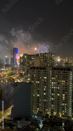 Ho Chi Minh City, Vietnam April 30, 2025 4k video of epic fire work performance to reunification Day of Vietnam at Sai Gon River look from the Gold view apartment, district 4 