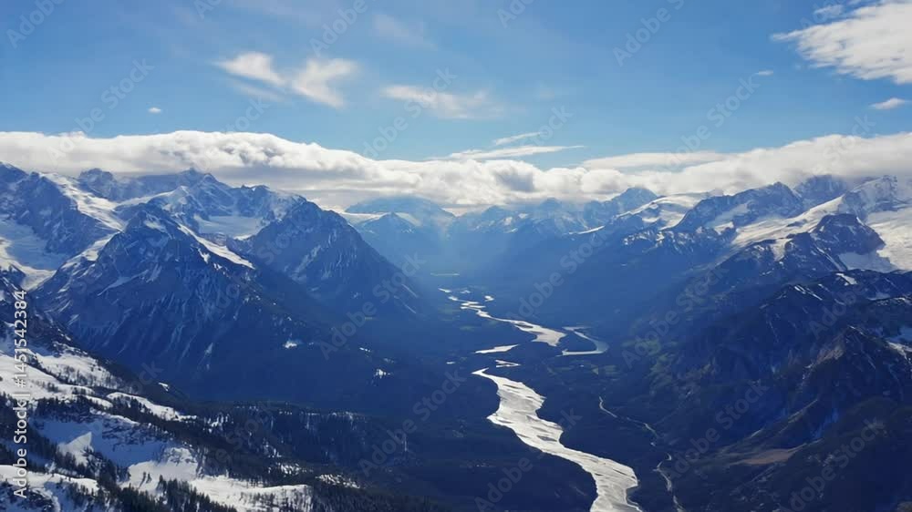 Aerial View of River Flowing Through Snow Covered Mountains Aerial View of River Flowing Through Snow Covered Mountains