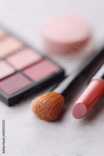 close-up of makeup essentials neatly arranged on minimalistic surface showcasing daily beauty items composition includes