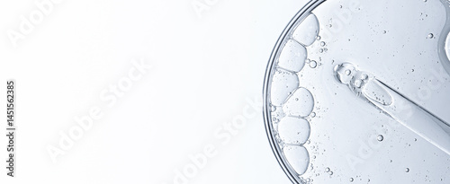 Cosmetic moisturizing gel or skin serum in a petri dish. Copy space