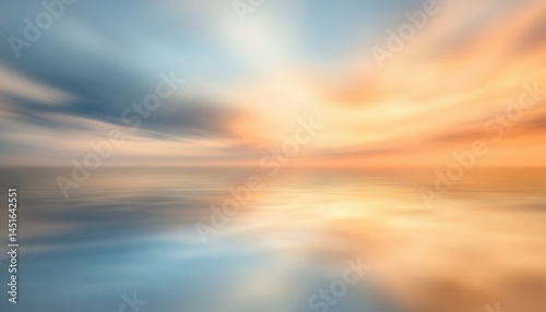 Warm Sky and Ocean Scene at Sunset with Smooth Water Surface and Motion Blur Effect Featuring Orange Blue and Yellow Color Palette