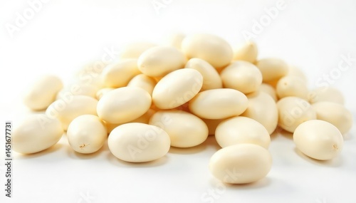Close-up of several white beans against a bright white background, texture, culinary art