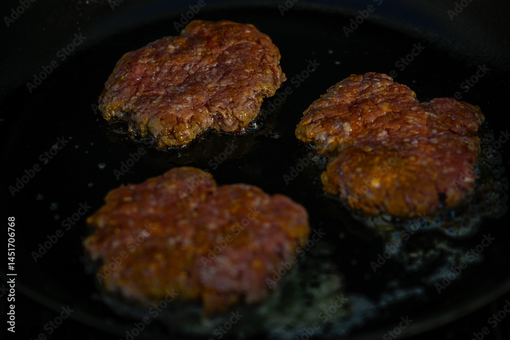 High resolution close up color image of the preparation of smash cheeseburgers on the grill- Israel High resolution close up color image of the preparation of smash cheeseburgers on the grill- Israel