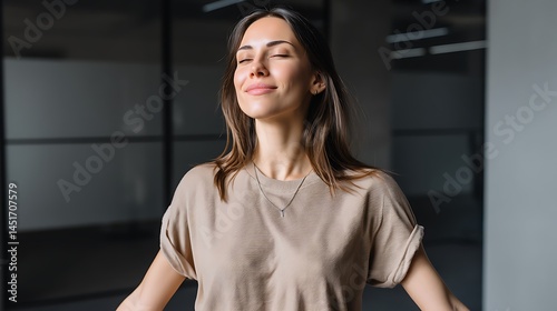 Young woman enjoying a moment of peace and tranquility in a modern office space with natural light and calm environment Free Download Young woman enjoying a moment of peace and tranquility in a modern office space with natural light and calm environment - GFXLoad