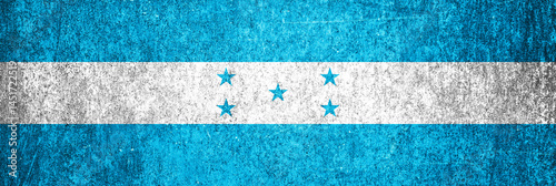 Honduras state flag on a metal surface. Banner of dirty grunge Honduras flag.