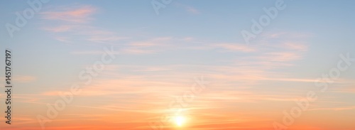 Sky with clouds at sunset featuring orange and blue colors. luxury premium real sunset and sunrise photo collection for background