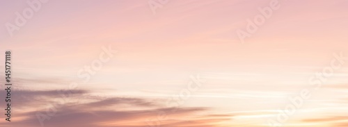 Soft pastel sky with clouds showing pink orange and yellow hues. luxury premium real sunset and sunrise photo collection for background