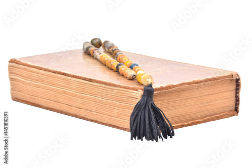 Obraz na płótnie Old book with beads on a white background isolated w salonie