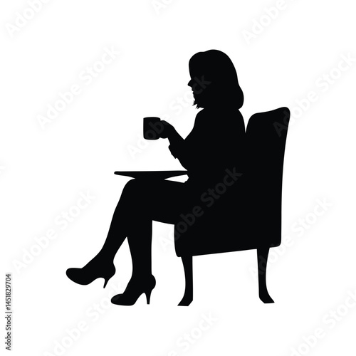 Silhouette of a woman sitting at a table enjoying a cup of coffee