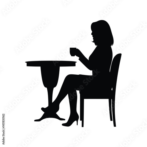 Silhouette of a woman sitting at a table enjoying a cup of coffee