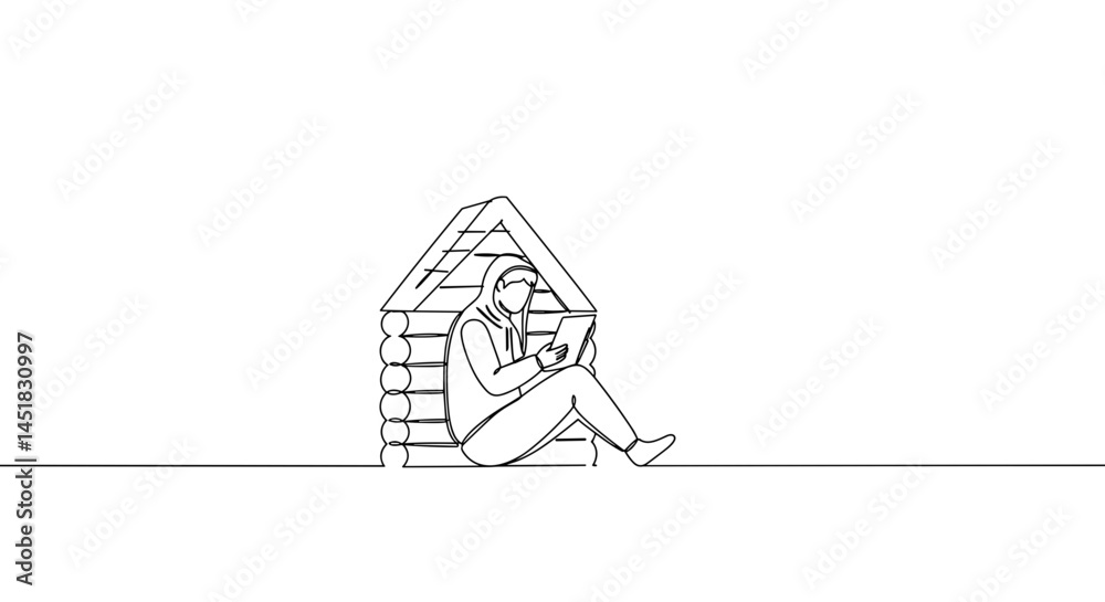 Person reading a book beside a cozy log cabin Person reading a book beside a cozy log cabin