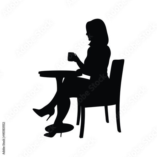 Silhouette of a woman sitting at a table enjoying a cup of coffee