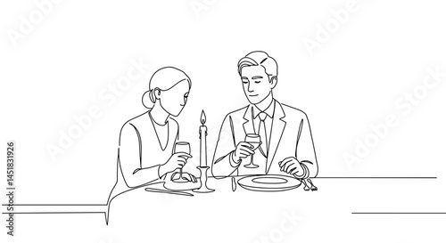 Elegant couple enjoying a romantic dinner by candlelight  