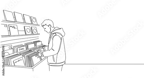 Young man browsing vinyl records in a minimalist store  