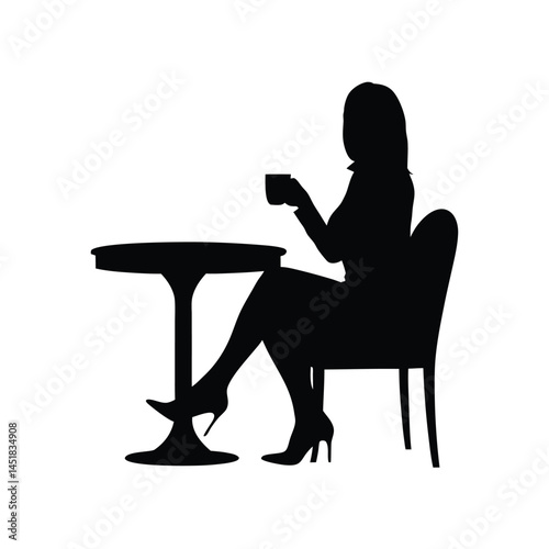 Silhouette of a woman sitting at a table enjoying a cup of coffee